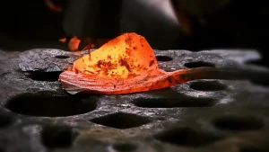 Red-hot steel blank during quenching in an industrial heat treatment process