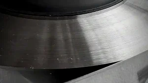Ink doctor blade coil with a precision ground lamella edge, Dekeer